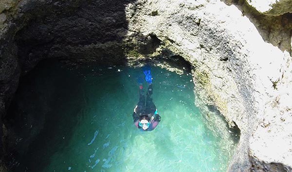 Women Snorkeling in a cave near Albufeira