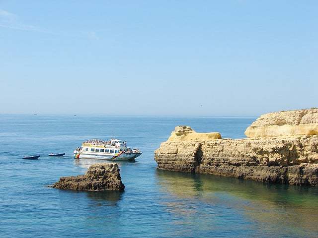 Catamaran Liana from Vilamoura approaching the cliffs
