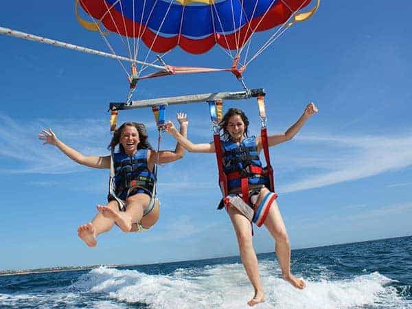 Children enjoying tandem parasailing near Vilamoura