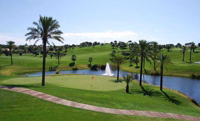 Gramacho Golf Course, small river and palm trees