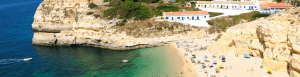 Small Benagil beach with the cliffs and small fishermans boats