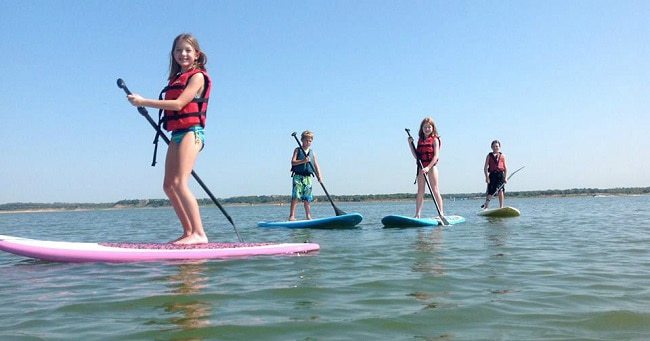 Kids learning Stand up Paddle