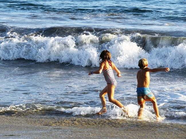 2 children playing in the Beach