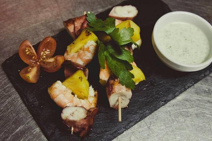 Octupus Kebab with king prawn and sauce aside