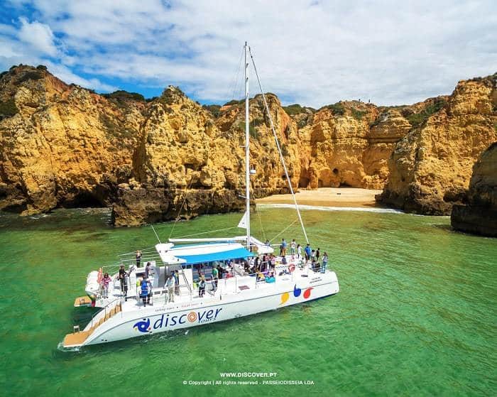 Catamaran Discover on the sea near Lagos full of clients