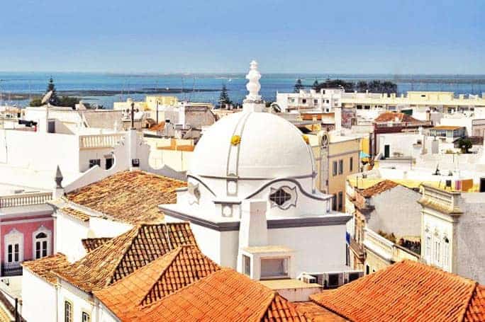 Top view for Olhão`s withe houses and orange roofs.